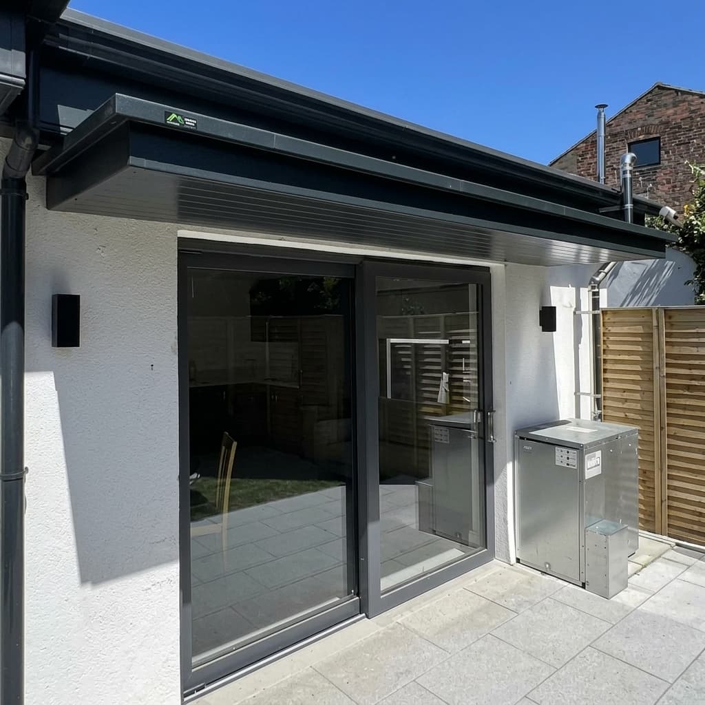 Modern flat canopy extension over sliding glass doors with clean finish